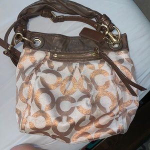 Coach crossbody or shoulder bag rose gold color
